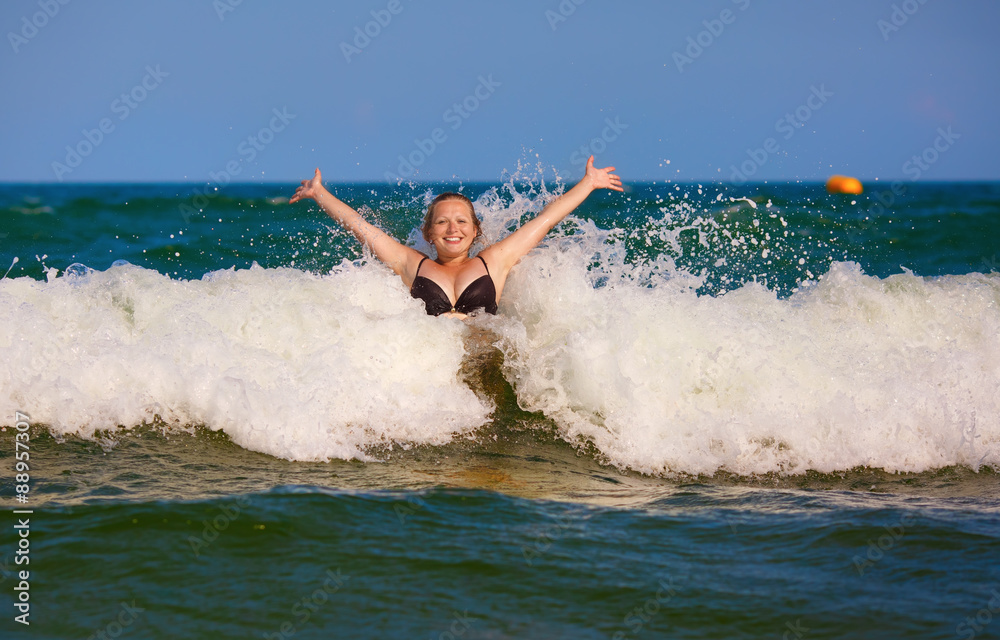Girl and sea wave