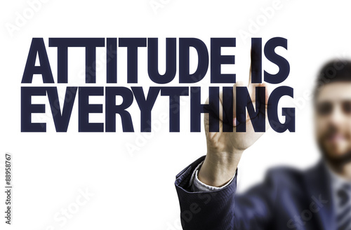 Business man pointing the text: Attitude is Everything