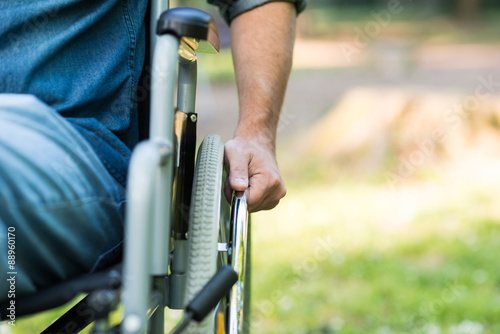 Detail of a man using a wheelchair photo
