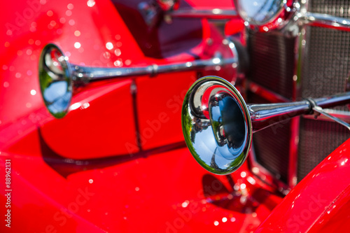 Old horns at an antique vintage red car photo