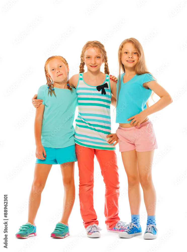 Obraz premium Portrait of three happy girls together hugging