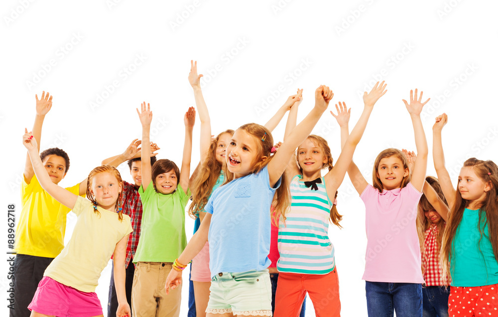 Happy smiling kids rise hands and cheer Happy smiling kids rise hands and cheer