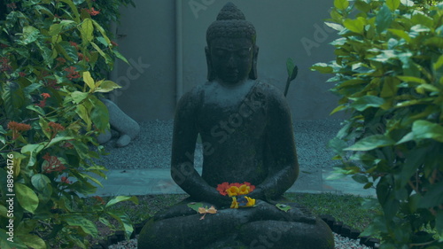 Gray stone buddha statue. Buddha Zen, religious concept. photo