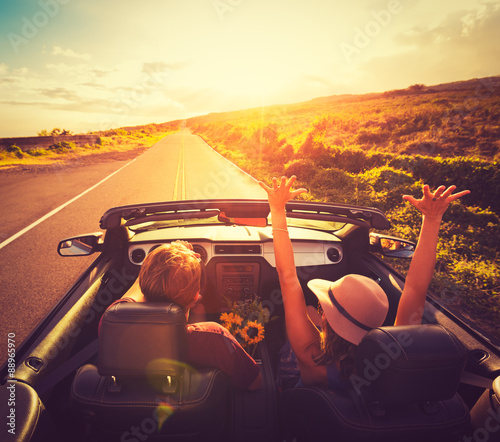 Couple Driving Convertable at Sunset