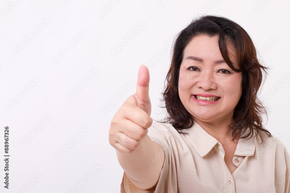 confident, successful middle aged woman showing thumb up hand ge confident, successful middle aged woman showing thumb up hand ge