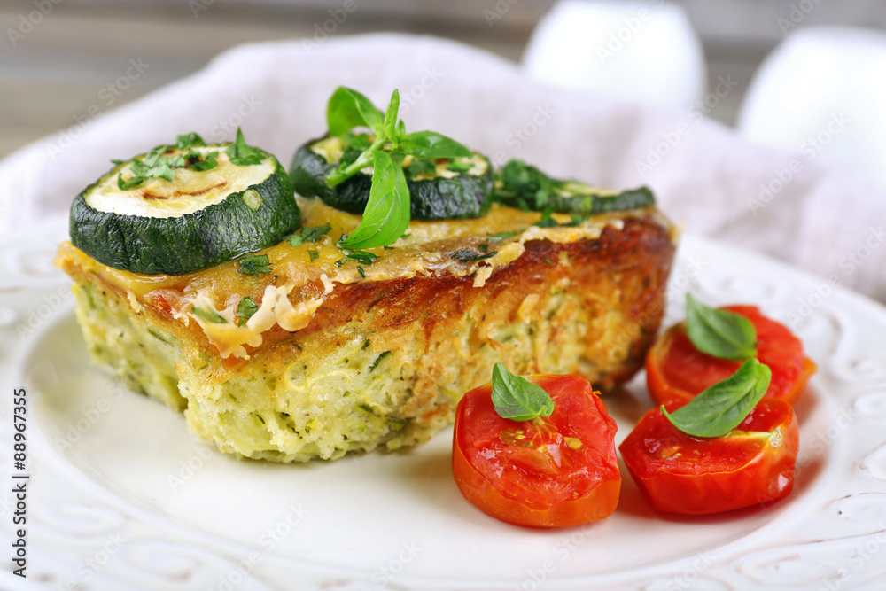 Casserole with vegetable mallow in white plate, closeup