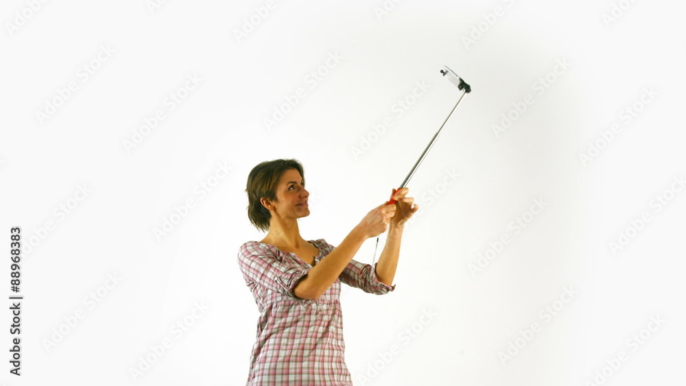 Pretty girl taking selfie with stick Pretty girl taking selfie with stick