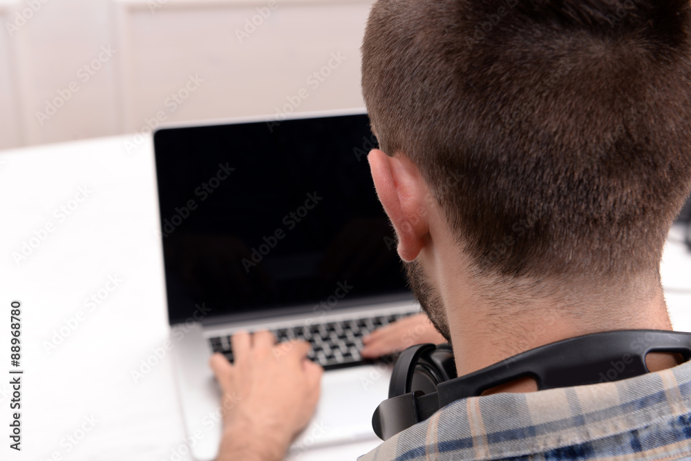 Young man with laptop close up Young man with laptop close up