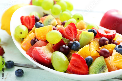 Fresh fruit salad on wooden table