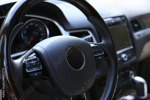 Modern car illuminated dashboard and steering wheel © Africa Studio