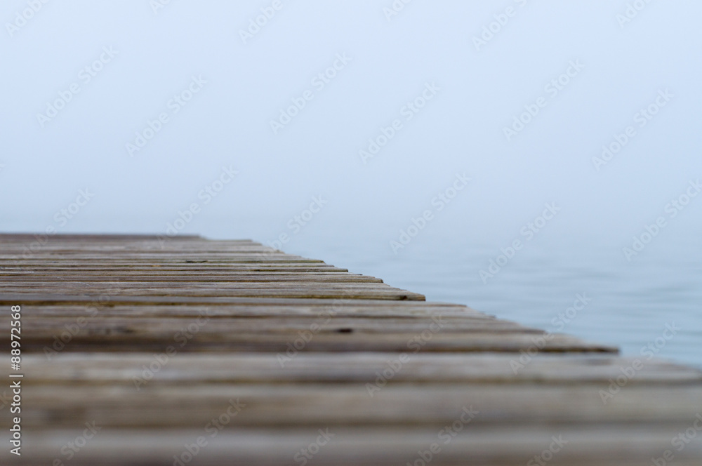 Abstract blurred view of misty lake with selective focus