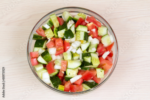 Vegetable salad with onion, tomato and cucumber