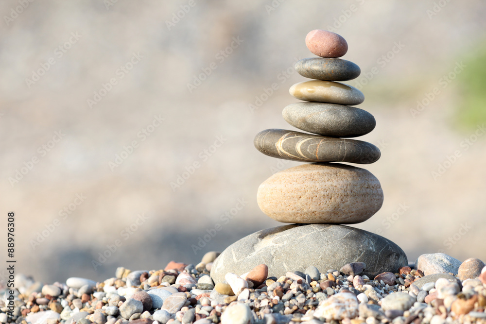 pile of balanced round stones on the beach pile of balanced round stones on the beach