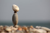 pile of balanced round stones on the beach