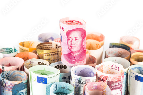 Pile of rolled-up currency notes with China Renminbi Yuan on top