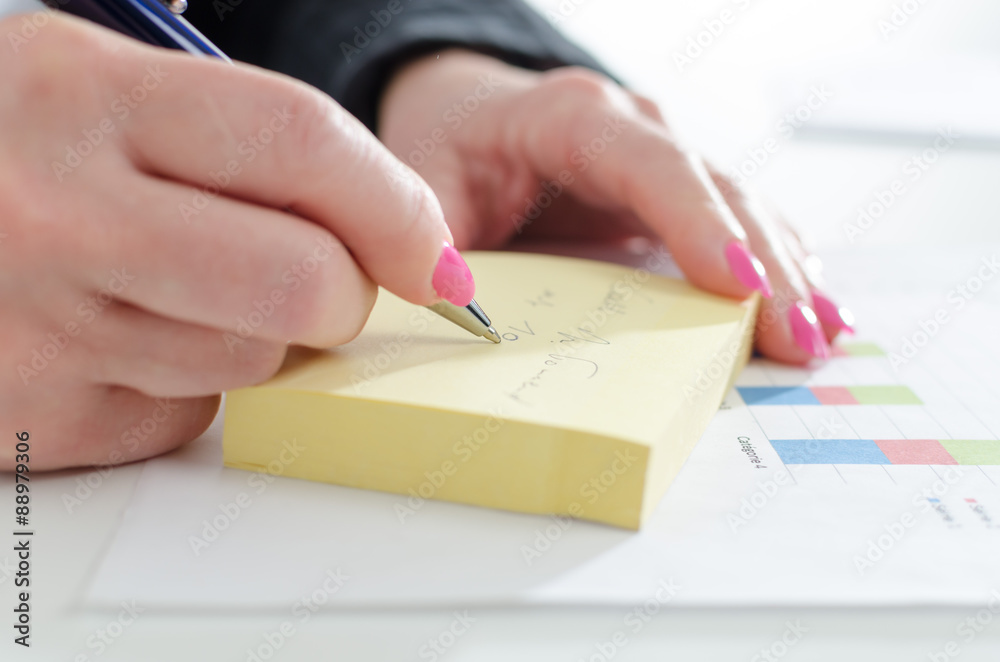Businesswoman taking notes Businesswoman taking notes