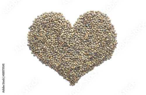 Marbled dark green lentils in a heart shape