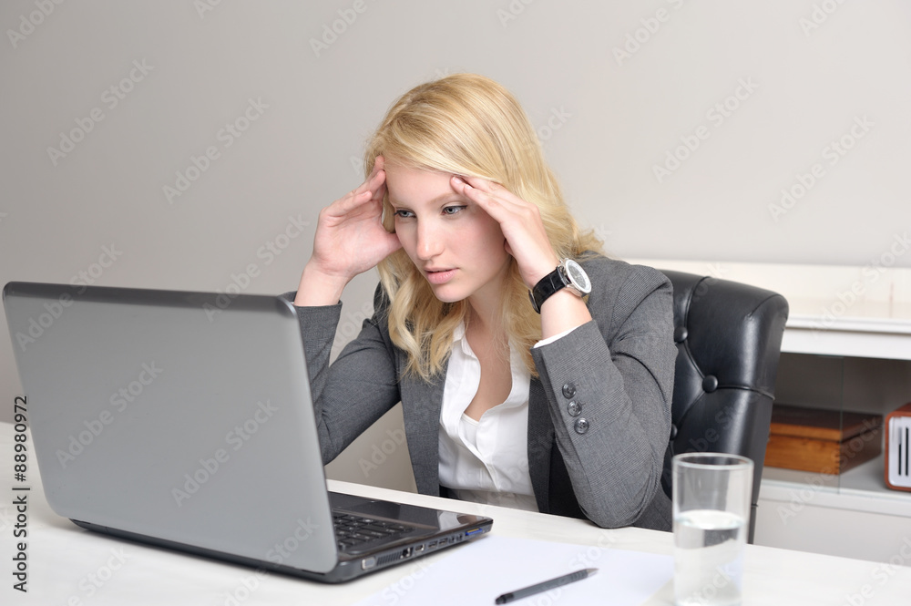 Woman concentrated looking at laptop screen