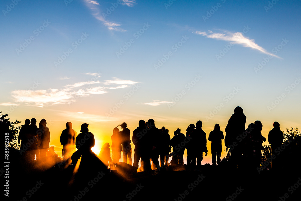 People enjoys the sunrise on the top of Merbabu volcano in Indon