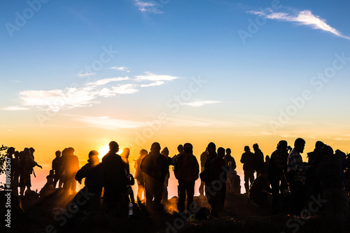 People enjoys the sunrise on the top of Merbabu volcano in Indon © jakartatravel