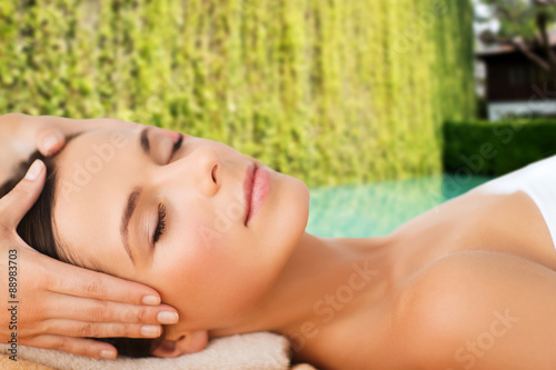 beautiful woman in spa salon having facial massage