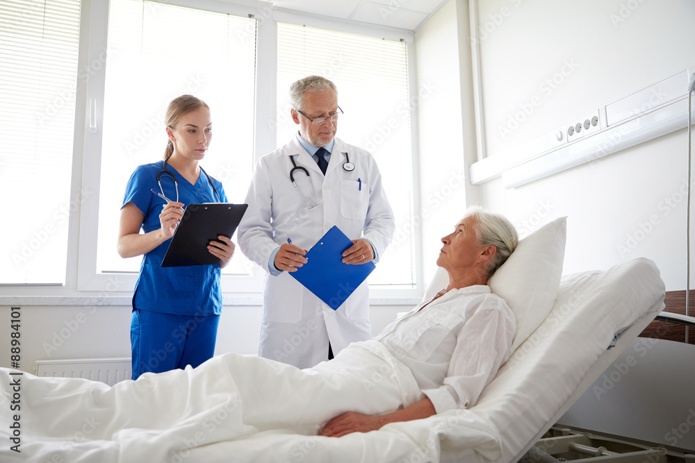 doctor and nurse visiting senior woman at hospital doctor and nurse visiting senior woman at hospital