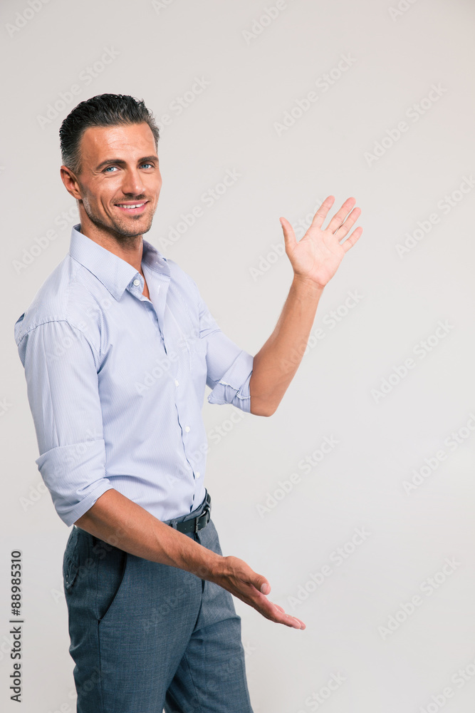 Businessman bragging about the size of something Businessman bragging about the size of something