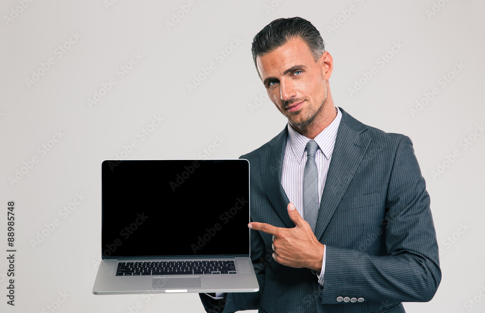 Businessman showing blank laptop computer screen Businessman showing blank laptop computer screen