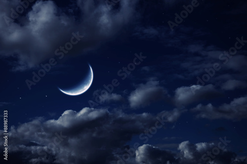 moon in the night cloudy sky with stars