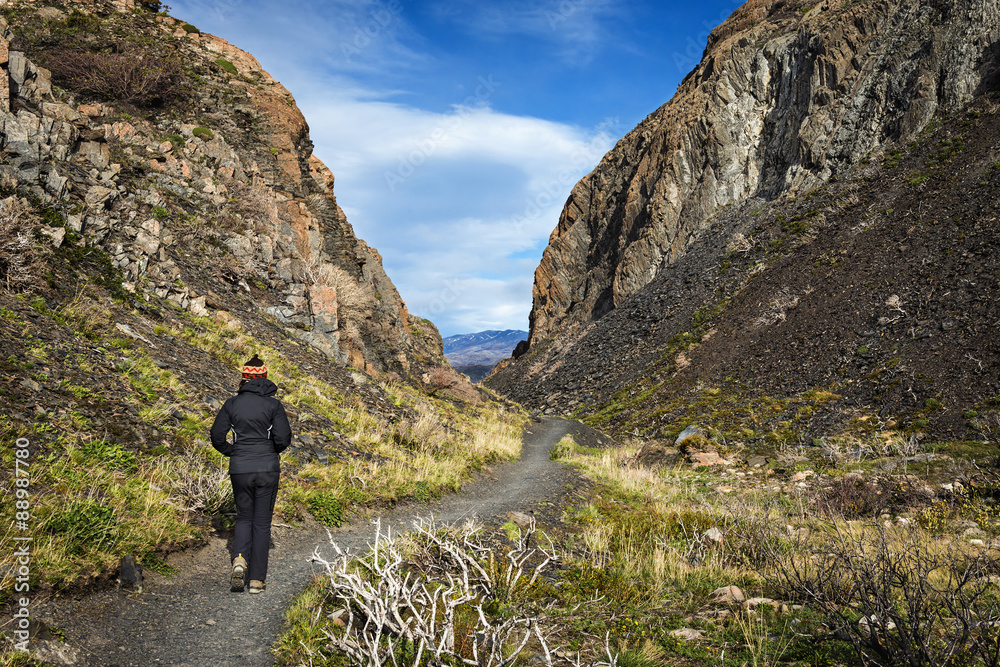 A women walking in the Torres del Paine National Park in Chile