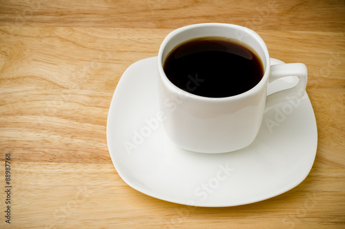 Hot coffee (black coffee) on wooden background © nungning20