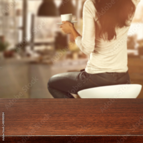 wooden desk space and woman with window sill 