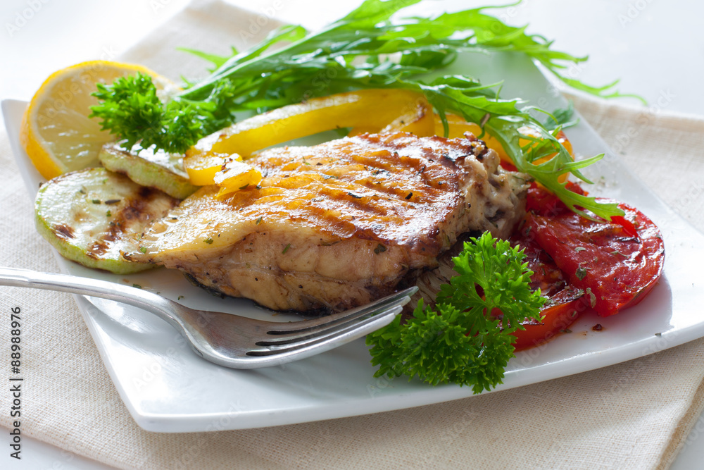 Grilled portion of flounder with vegetables Grilled portion of flounder with vegetables