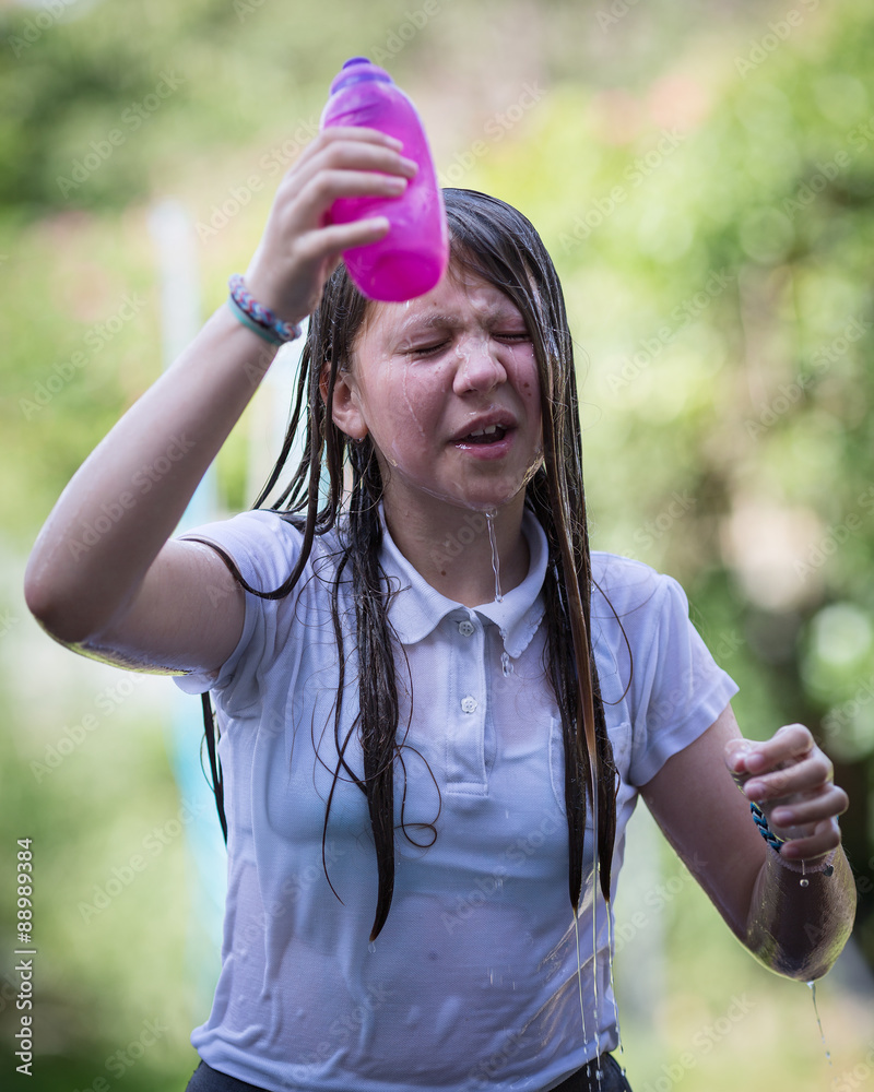 Teenage Girl Cools Down By Throwing Water Over Her Head Stock Photo Adobe Stock