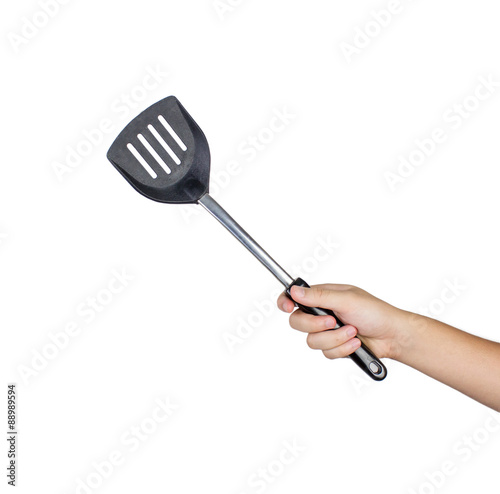 hand holding flipper frying isolated on white background