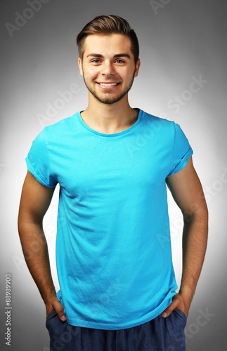 Handsome man on gray backgr...