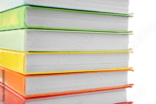 Colorful books close-up on white background