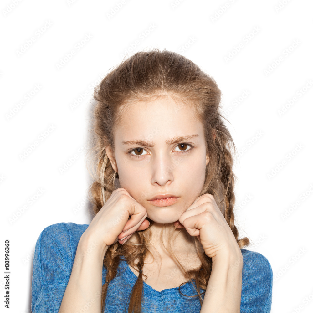 girl with two hands in fists, face contorted in anger