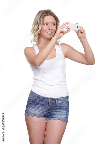 Happy Girl posing for a photograph taken from his cell phone