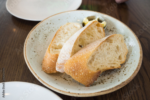 Baguette bread with small butter bow