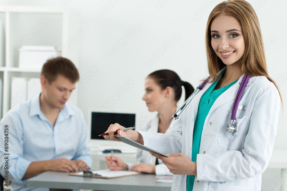 Portrait of beautiful smiling female medicine doctor Portrait of beautiful smiling female medicine doctor