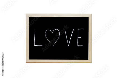 Foto Love written with white chalk on blackboard.