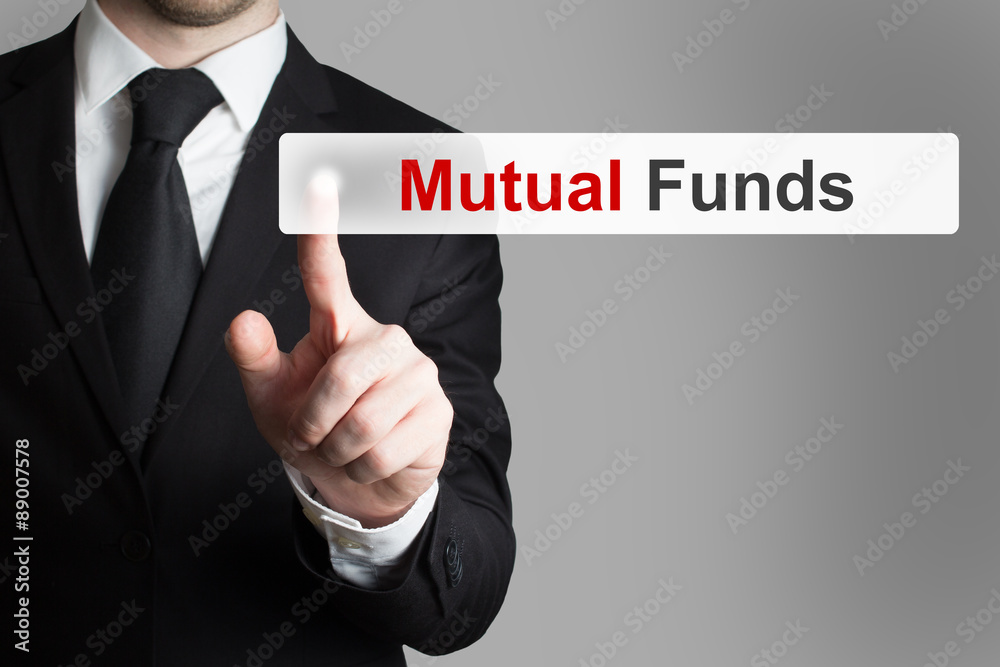 businessman pushing touchscreen button mutual funds businessman pushing touchscreen button mutual funds