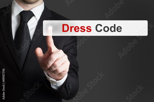 businessman pushing button dress code