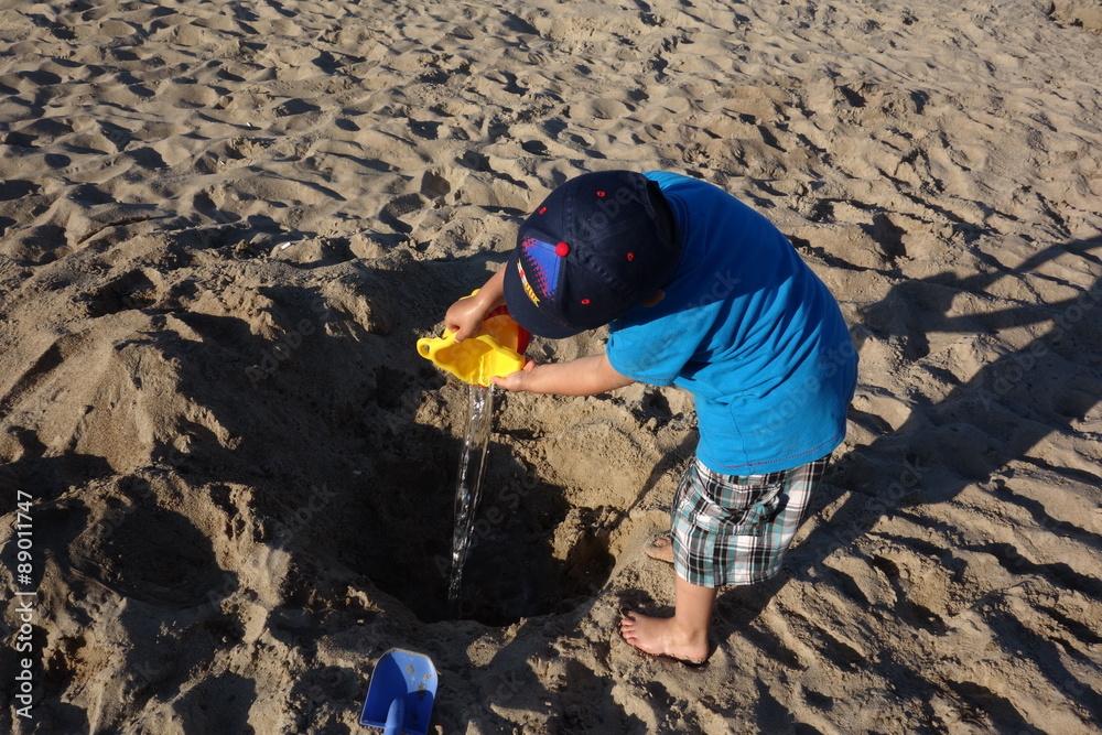 little boy playing on the beach little boy playing on the beach