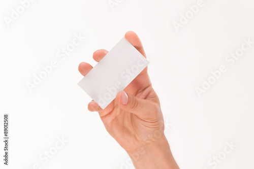Man's hand holding blank card