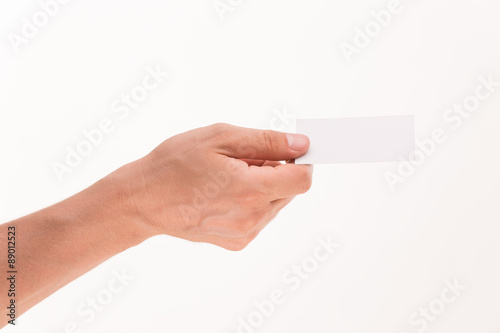 Man's hand holding blank card