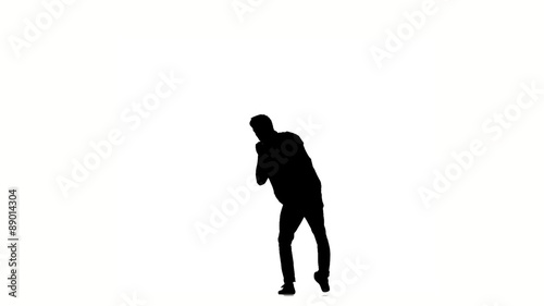 Young hip-hop man doing brake dancing movements, on white, slow photo