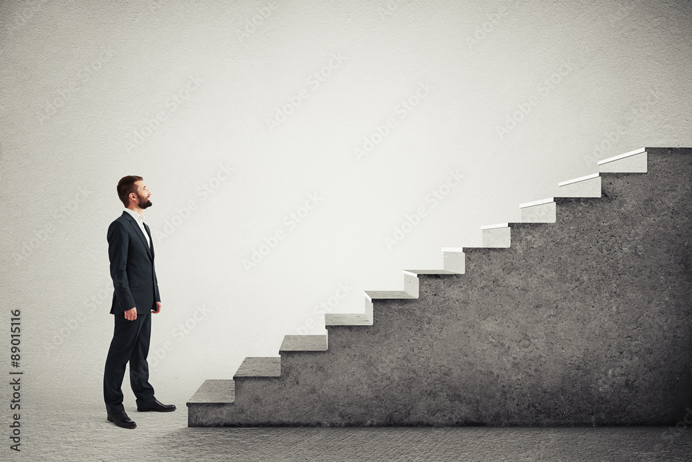 man standing near concrete stairs
