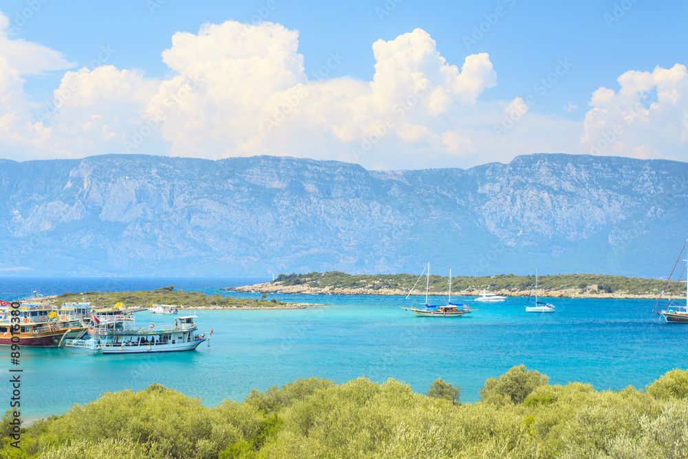 tourist ship with mountain in background tourist ship with mountain in background